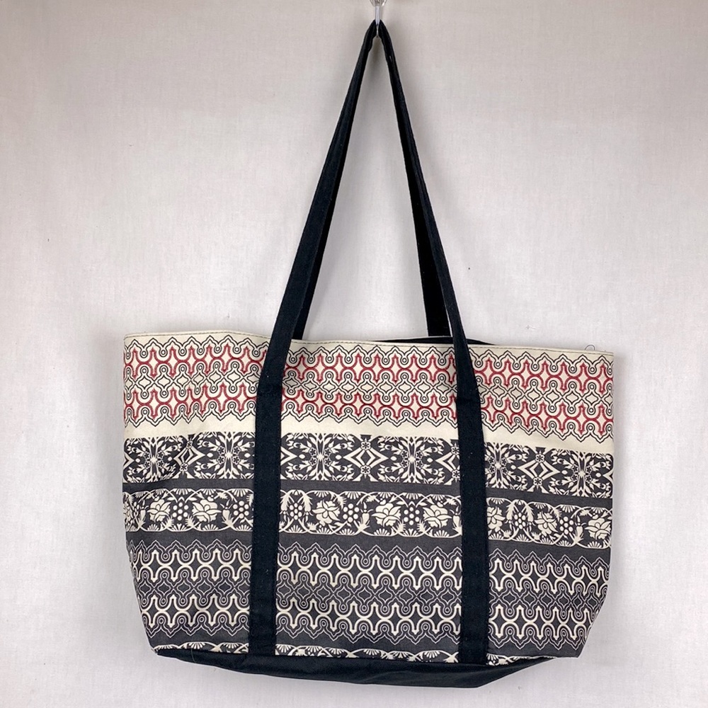 Canvas tote bag purse in black white and red embroidered accents.
